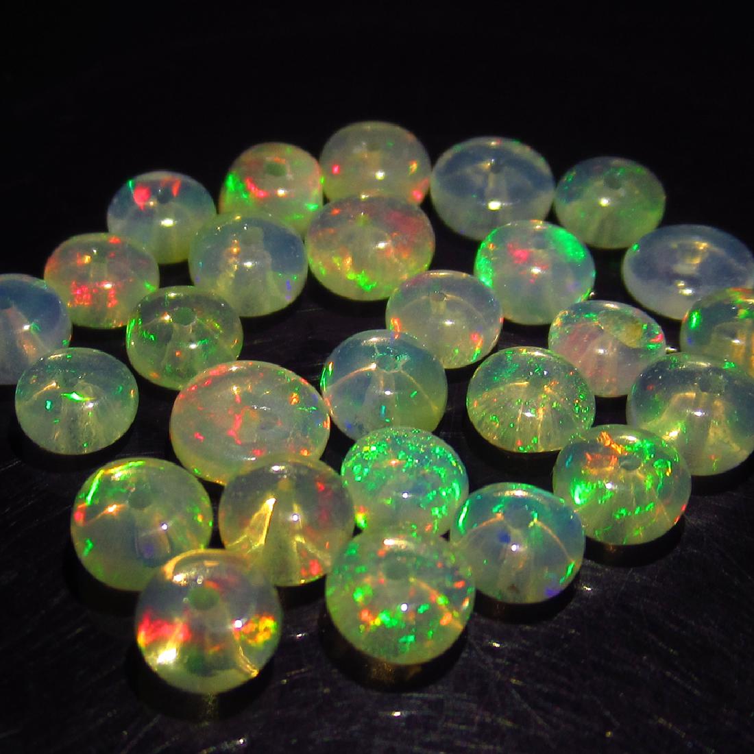 6.50 Ct Genuine 27 Drilled Round Fire Opal Beads: No Reserve! Title: 6.50 Ct Genuine 27 Drilled Round Fire Opal Beads Stone Clarity: Transparent Gemstones: Natural Opal Beads Carat Weights: 6.50 Size/Dimensions: 4.00 to 5.30 mm / 27 PC's Additional I