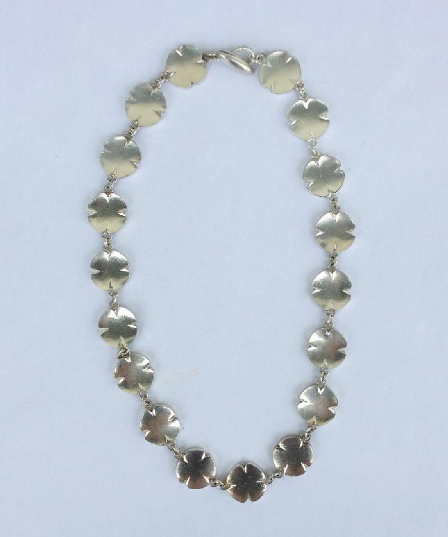 Silver necklace by Arvo Saarela, Sweden, 1960s: Reserve Reduced! Massive silver necklace made up of stylized flowerheads or four leaf clovers. Makers mark AMS for Arvo and Maria Saarela, the Swedish silver hallmark (three crowns and an S, for a sil