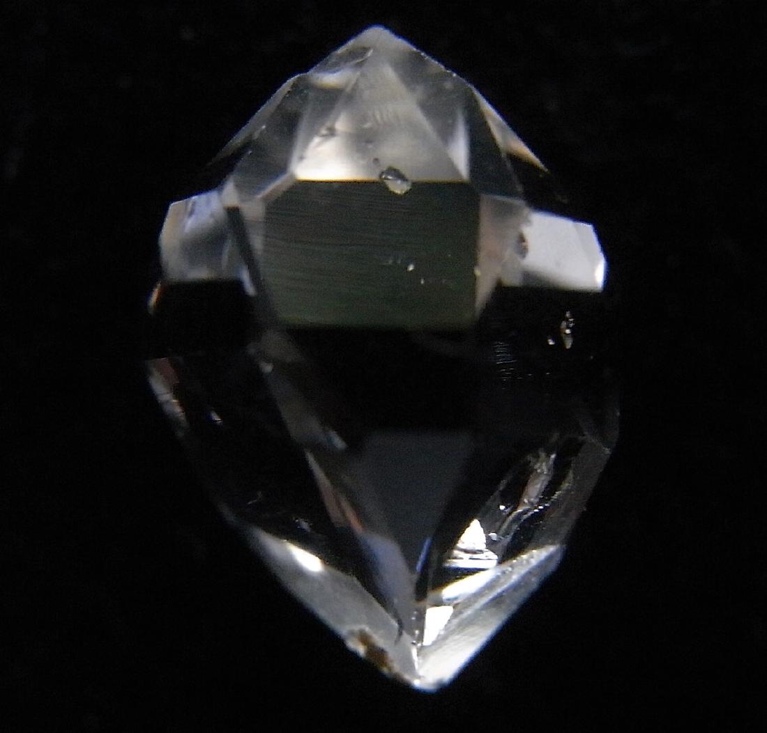 VERY CLEAR GENUINE HERKIMER DIAMOND: Title: VERY CLEAR GENUINE HERKIMER DIAMOND Origin: Ace of Diamonds Mine, Middleville, New York, USA Size: 1.1x0.9x0.7 cm / 0.77 gram Description: very clear quartz var herkimer diamond with hoppered s