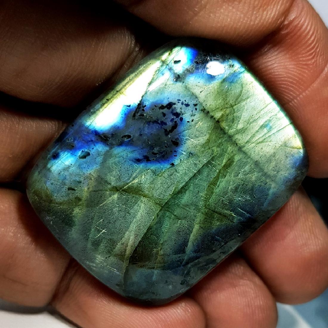 69.85 ct Natural Labradorite: No Reserve! Title: 69.85 ct Natural Labradorite Color/Clarity: Opaque Gemstones: Gemstones Carat Weights: 69.85 Size/Dimensions: 36.00 x 28.90 x 6.75 Additional Information: Rectangular - USA Shippi