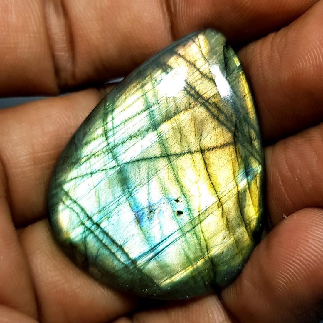 49.85 ct Natural Labradorite: No Reserve! Title: 49.85 ct Natural Labradorite Color/Clarity: Opaque Gemstones: Gemstones Carat Weights: 49.85 Size/Dimensions: 39.00 x 30.80 x 5.25 Additional Information: Pear - USA Shipping: