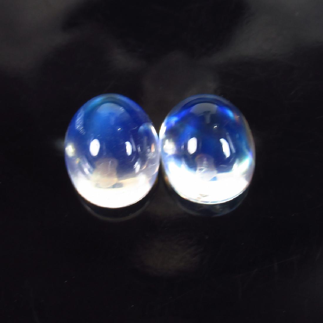 7.47 Ctw Natural Blue Moonstone 12X8 mm Oval Pair: Title: 7.47 Ctw Natural Blue Moonstone 12X8 mm Oval Pair Stone Clarity: Transparent Gemstones: Blue Moonstone Carat Weights: 7.47 Size/Dimensions: 10.00 x 8.00 x 6.70 mm / 2 PC's Additional Informatio