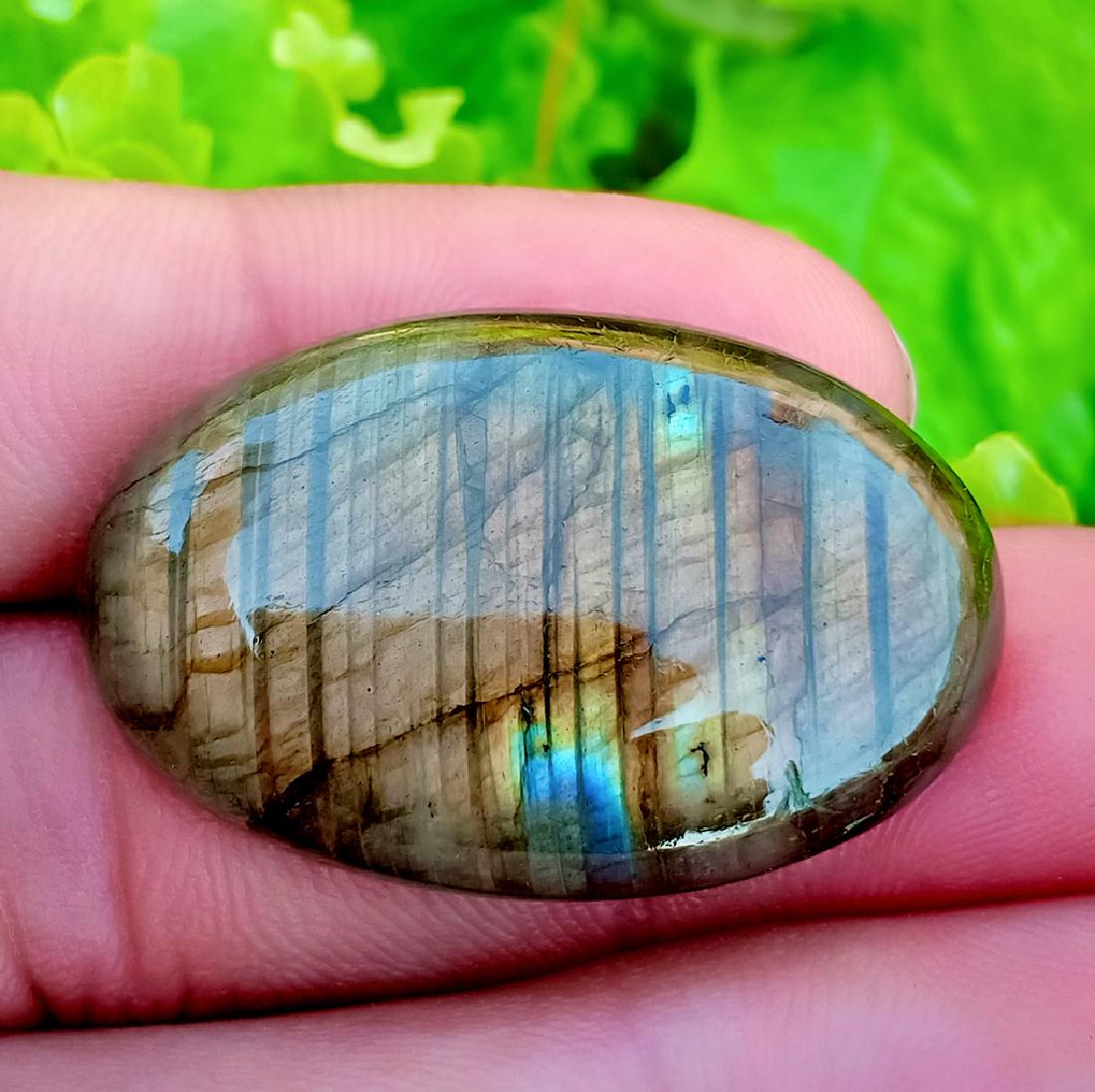 53.10 Carat Beautiful Natural Labradorite Cab: Title: 53.10 Carat Beautiful Natural Labradorite Cab Color/Clarity: None Gemstone: Labradorite Carat Weights: 53.10 Carat Size/Dimensions: 34x22x8 mm Origin: Africa Treatment: Natural Reserve: $20.00