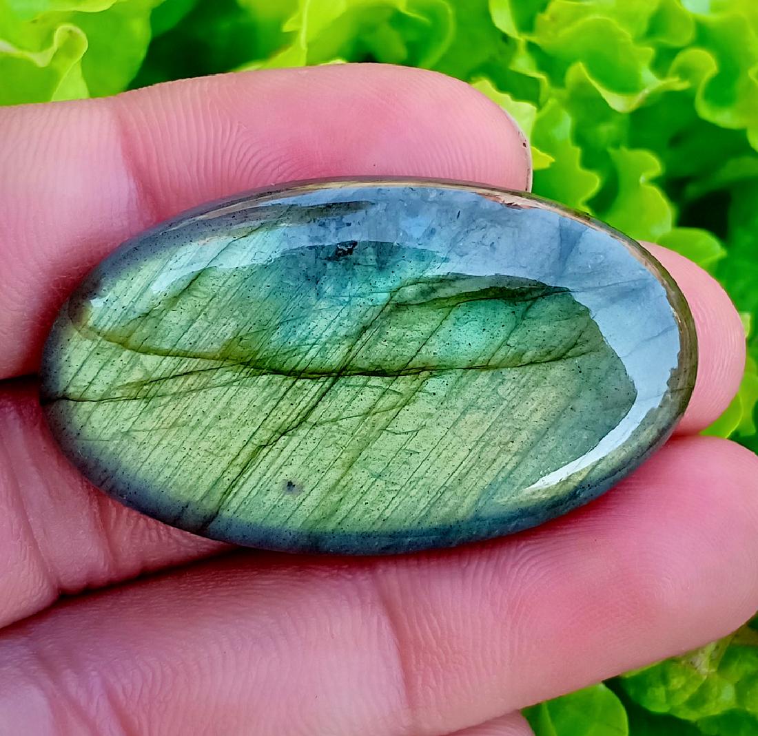 65.05 Carat Beautiful Natural Labradorite Cab: Title: 65.05 Carat Beautiful Natural Labradorite Cab Color/Clarity: None Gemstone: Labradorite Carat Weights: 65.05 Carat Size/Dimensions: 42x25x7 mm Origin: Africa Treatment: Natural Reserve: $25.00