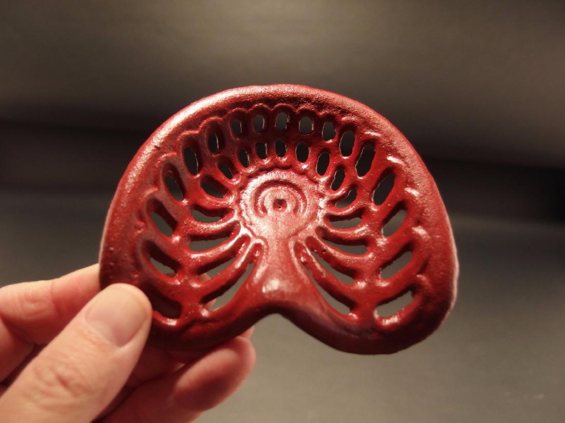 Miniature RED Cast Iron Farm Tractor Seat Paperweight: 4 1/8" x 3 1/2" Great reproduction antique folk art cast iron tractor seat. This piece was cast to look just like the larger version likely as a salesman sample. Makes a great paperweight for any coll