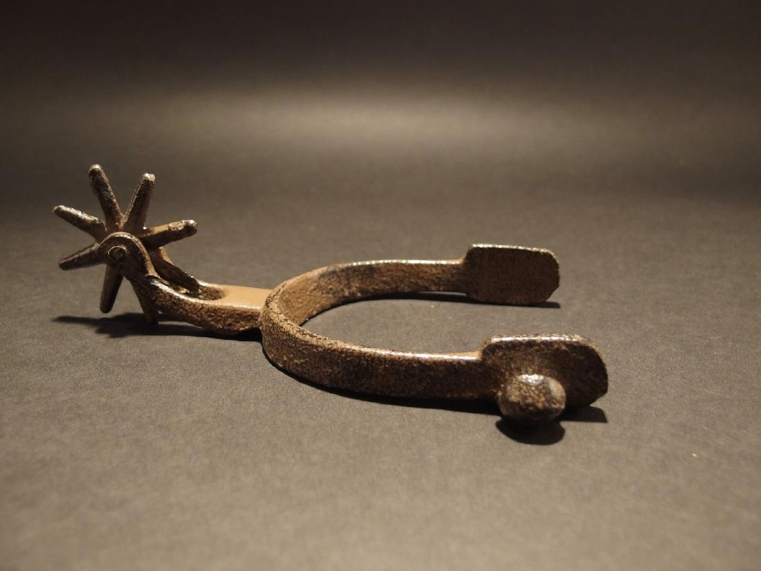 Cast Iron Western Cowboy Decor Spur: 6 3/4" Long x 4" Wide Such a neat reproduction cast iron western spur. This antique style spur makes a great decoration in any western cowboy home decor. All cast iron and powder coated in a brown bla