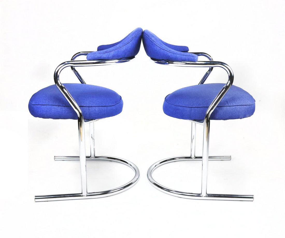 Pair of Anton Lorenz for Thonet Chrome Chairs: A Pair of tubular chrome cantilevered arm chairs attributed to Anton Lorenz for Thonet that fit perfectly with today's style. Sculpted chrome design with a minimal modern style.; Professionally re-uph