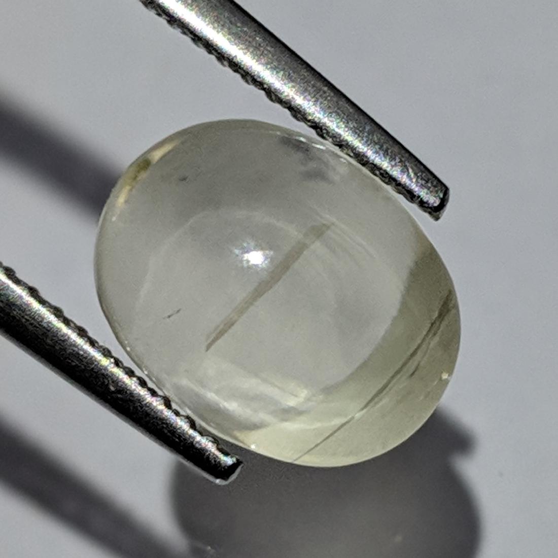 4.56 ct Natural Scapolite Cat's eye: No Reserve! Title: 4.56 ct Natural Scapolite Cat's eye Color/Clarity: Opaque Carat Weights: 4.56 Size/Dimensions: 10.45 x 8.35 x 7.50 Additional Information: Oval - Africa Shipping: Worldwide: Fla