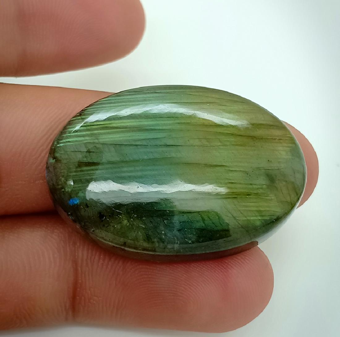 60.45 Carat Stunning Natural Labradorite Cab: Reserve Reduced! Title: 60.45 Carat Stunning Natural Labradorite Cab Color/Clarity: None Gemstones: Labradorite Carat Weights: 60.45 Carat Size/Dimensions: 35x24x8 mm Origin: Africa Treatment: Natural