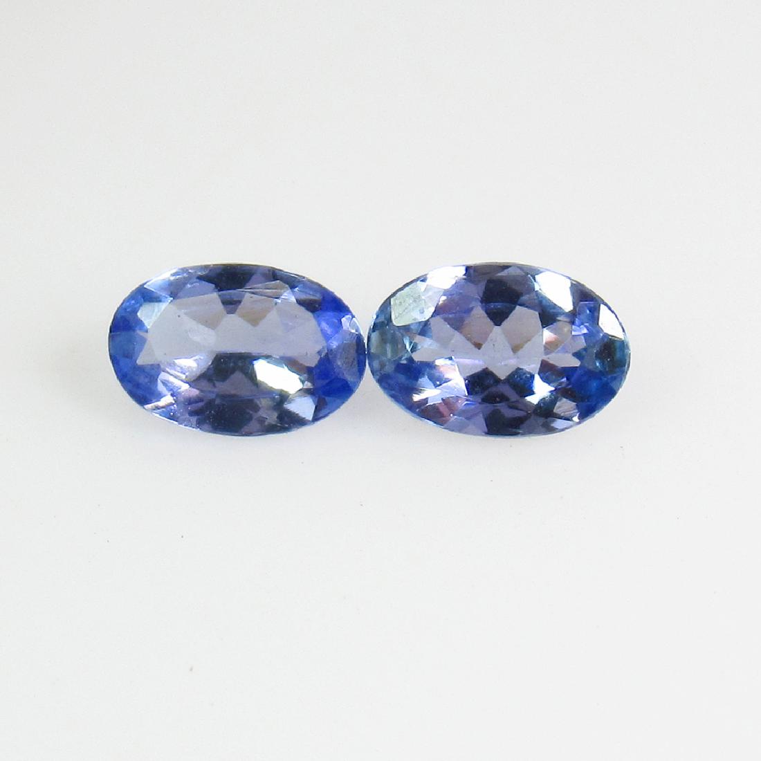 0.74 Ctw Natural Tanzanite 6X4 mm Oval Pair: No Reserve! Title: 0.74 Ctw Natural Tanzanite 6X4 mm Oval Pair Stone Clarity: VVS Gemstones: Tanzanite Carat Weights: 0.74 Size/Dimensions: 5.90 x 3.90 x 2.30 mm Additional Information: Top Class Lust