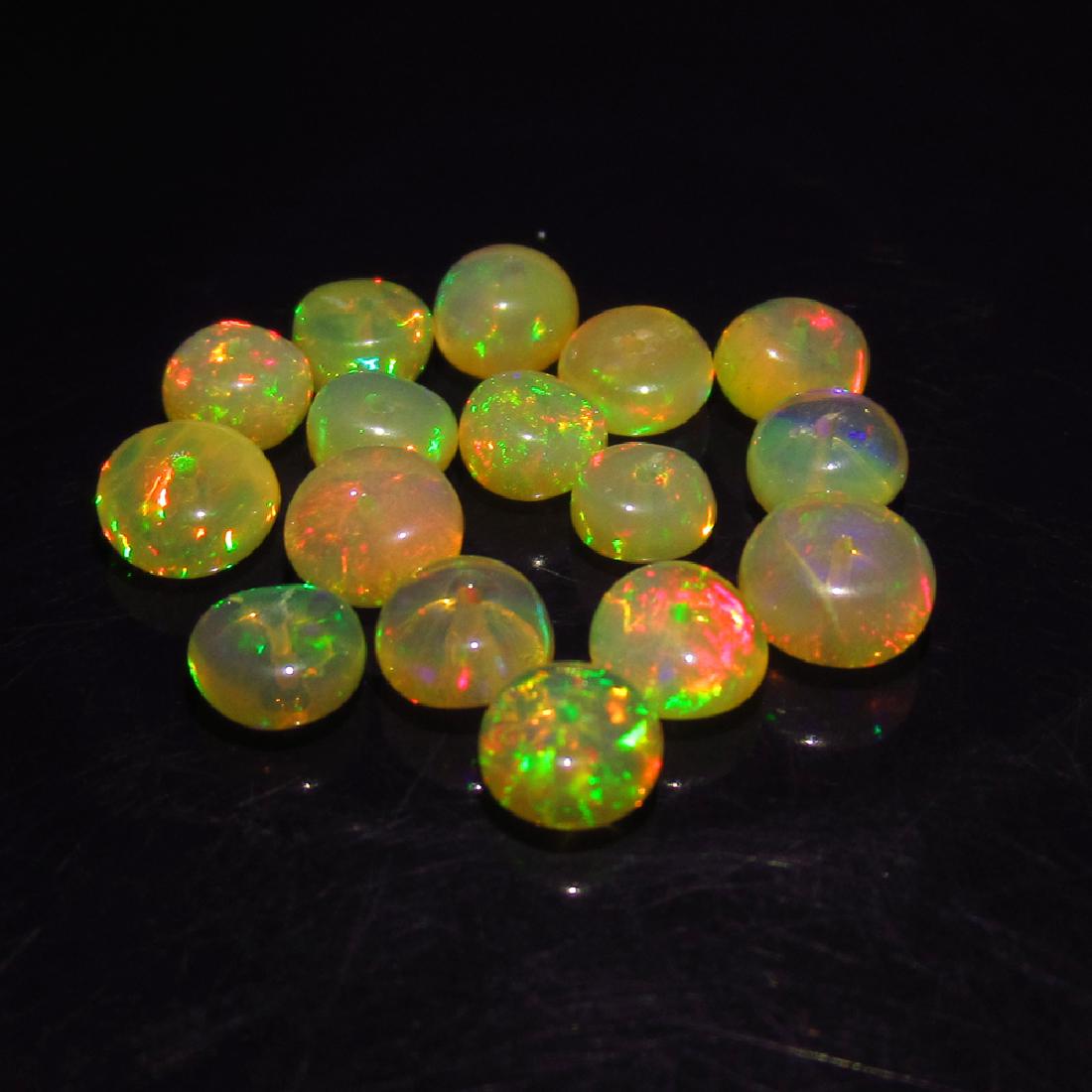 5.40 Ct Genuine 16 Drilled Multi-Color Fire Round Opal: No Reserve! Title: 5.40 Ct Genuine 16 Drilled Multi-Color Fire Round Opal Beads Stone Clarity: Transparent Gemstones: Natural Opal Beads Carat Weights: 5.40 Size/Dimensions: 4.20 to 5.40 mm / 16 PC's 