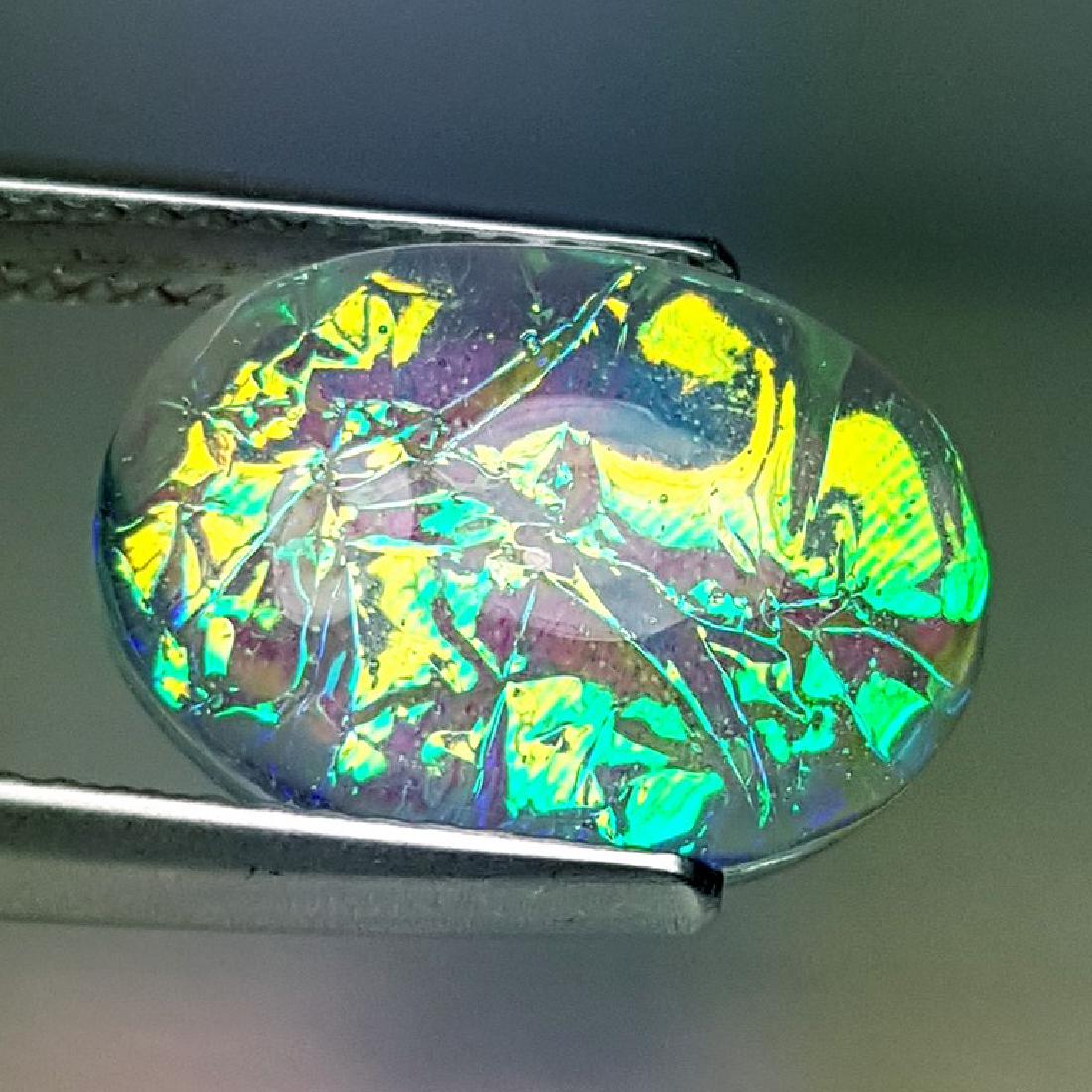 5.95 ct Australian Doublet Opal: No Reserve! Title: 5.95 ct Australian Doublet Opal Color/Clarity: Semi Transparent Gemstones Carat Weights: $6 Size/Dimensions: 14.23 x 10.20 x 5.50 Additional Information: Oval - Australia Shipping