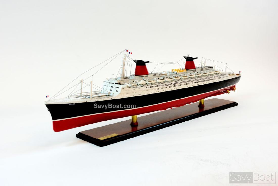 SS France: SS France Dimension approx.: 41.5" L x 4.5" W x 11.5" H - Scale 1:300; The model is already built, NOT a model ship kit; Handcrafted from scratch using finest woods & metal fittings Description SS Fra