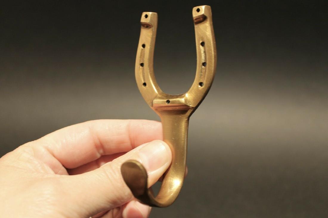 Brass Horse Shoe Wall Hook Coat Hanger Leash Key: 1) Hook 4" Tall.. 1 7/8" Wide 1 5/8" Extension Great sturdy brass wall hook cast from an antique. Reserve: $13.00 Shipping: Domestic: Flat-rate of $6.00 to anywhere within the contiguous U.S. Internat