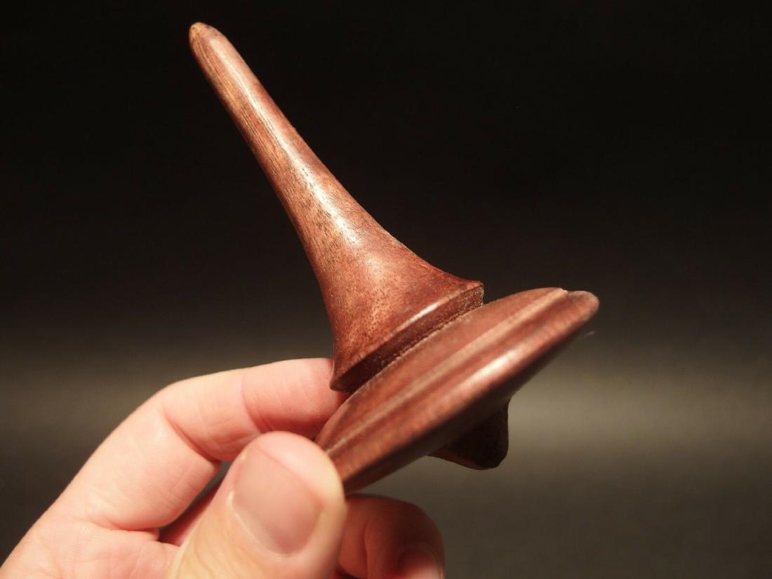Wood Spinning Top Toy: 4 1/2" Tall x 2 5/8" wide Wonderful reproduction american antique wood turned spinning top. Handmade wood spinning tops like this were some of the oldest and simplest toys made. Children who frequentl