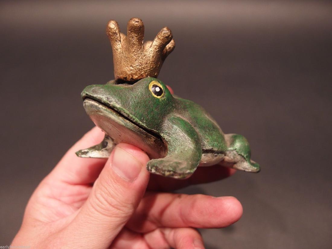 Folk Art Beer Soda Bottle Cap Frog Opener: 3 3/4" Long x 2 3/4" Wide x 2 1/4" Tall Great folk art cast iron bottle opener. This piece was hand painted and aged to look like an antique. Reserve: $15.00 Shipping: Domestic: Flat-rate of $7.00 to 