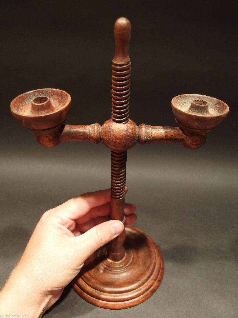 Colonial Wood Lighting Double Lamp Candle Holder: 12" Tall 5 1/4" Wide Basethe candle socket interior measurement is 5/8" Nice Reproduction wood candle holder distressed to look like an antique.... The candle sockets adjust up and down the shaft by r