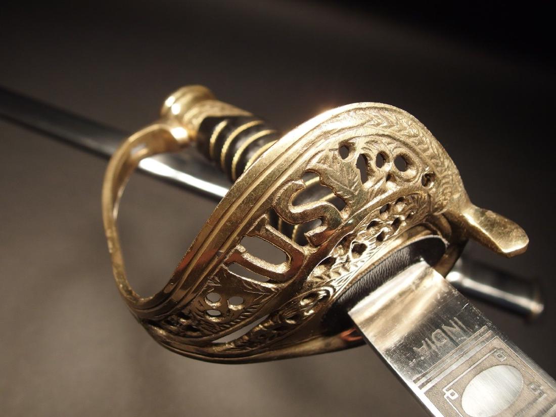 Light Cavalry Union Civil War Carbon Steel Sword: 38" Long with handle...with scabbard 42" 4" leather Grip Nice reproduction of a 1860 saber solid brass & leather wrapped handle, non sharpened carbon steel blade with a steel and brass scabbard. It ha