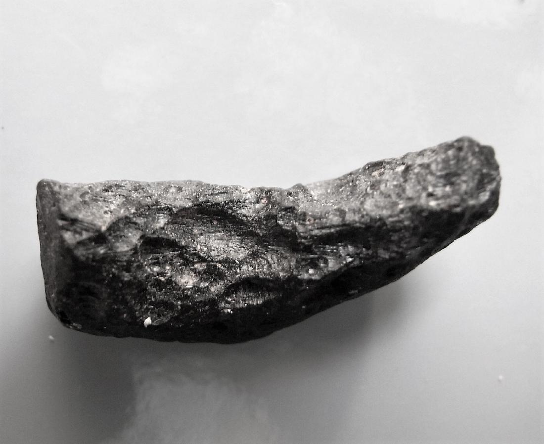 THAILANDITE TEKTITE - FROM METEORITE IMPACT: Title: THAILANDITE TEKTITE - FROM METEORITE IMPACT Origin: Noen Sa-nga, Chaiyaphum Province, Thailand Size: 1.5x1x1 cm / 4 gram irregular rounded thailandite tektite with small pits. a few tiny glassy