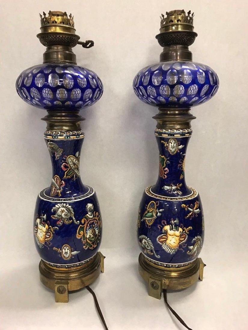 Pair Painted Ceramic Brass Table Lamps: Reserve Reduced! Pair of Painted Ceramic and brass Vintage table Lamps. Electric and work. They have swords and armor painted on them. No harps, finials or shades. They are 20.5" by 5.5". Please look