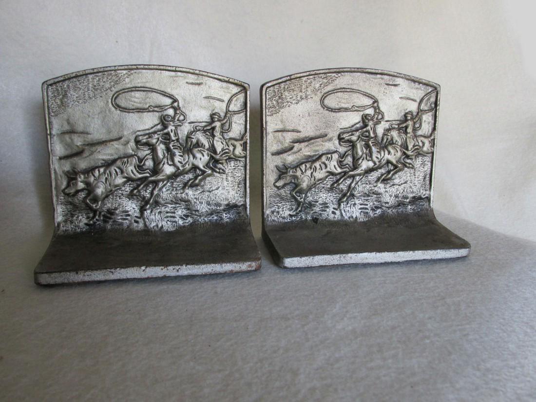 Antique Cowboy & Steer Bookends, Cast Iron Western,: Reserve Reduced! Item: Antique Cowboy & Steer Bookends, Cast Iron Western, Desk Accessory Origin: United States Date/Period: 1930s Materials: Cast Iron Size: Each Bookend measures 5 1/4" wide x 4 3/4"