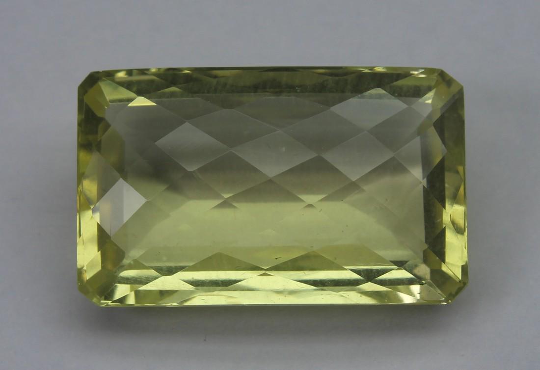 17.64 Cts Natural Lemon Quartz: No Reserve! Title: 17.64 Cts Natural Lemon Quartz Additional Information: Gemstone : Lemon Quartz W1eight : 17.64 Cts Shape : Rectungular Cushion Cut Colour : Greenish Yellow Dimensions : 20x12.7x8.4 