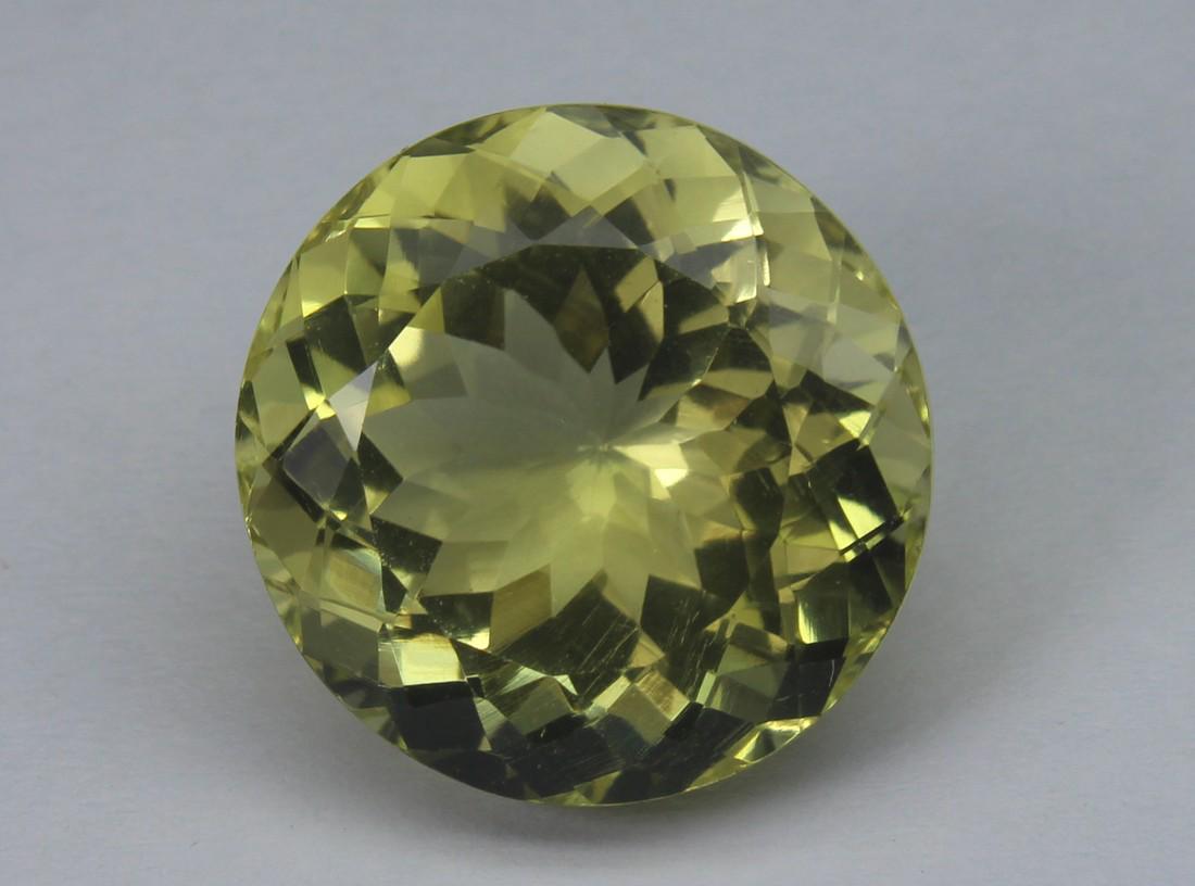 13.73 Cts Natural Lemon Quartz: No Reserve! Title: 13.73 Cts Natural Lemon Quartz Additional Information: Gemstone : Lemon Quartz Weight : 13.73 Cts Shape : Round Cut Colour : Greenish Yellow Dimensions : 15.2-15.4x10.4 mm Origin : 
