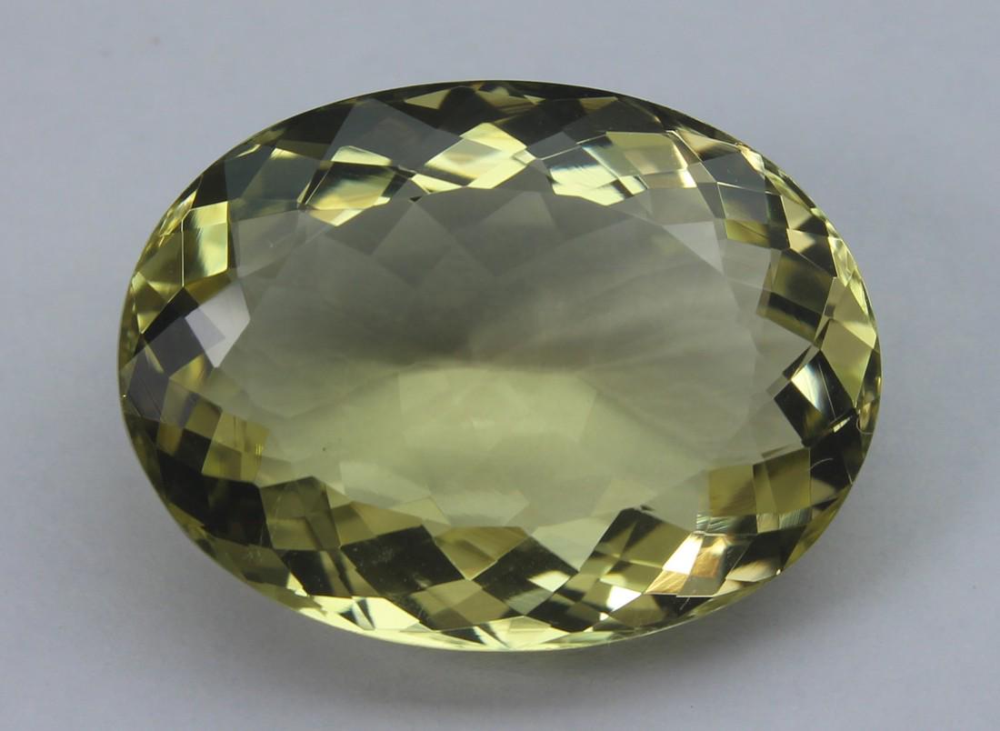 15.59 Cts Natural Lemon Quartz: No Reserve! Title: 15.59 Cts Natural Lemon Quartz Additional Information: Gemstone : Lemon Quartz Weight : 15.59 Cts Shape : Oval Cut Colour : Greenish Yellow Dimensions : 19.7x4.6x8.5 mm Origin : Afr