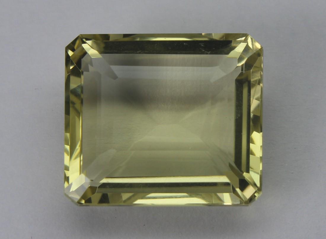 21.37 Cts Natural Lemon Quartz: No Reserve! Title: 21.37 Cts Natural Lemon Quartz Additional Information: Gemstone : Lemon Quartz Weight : 21.37 Cts Shape : Rectungular Cut Colour : Greenish Yellow Dimensions : 18.5x16.1x8.6 mm Orig