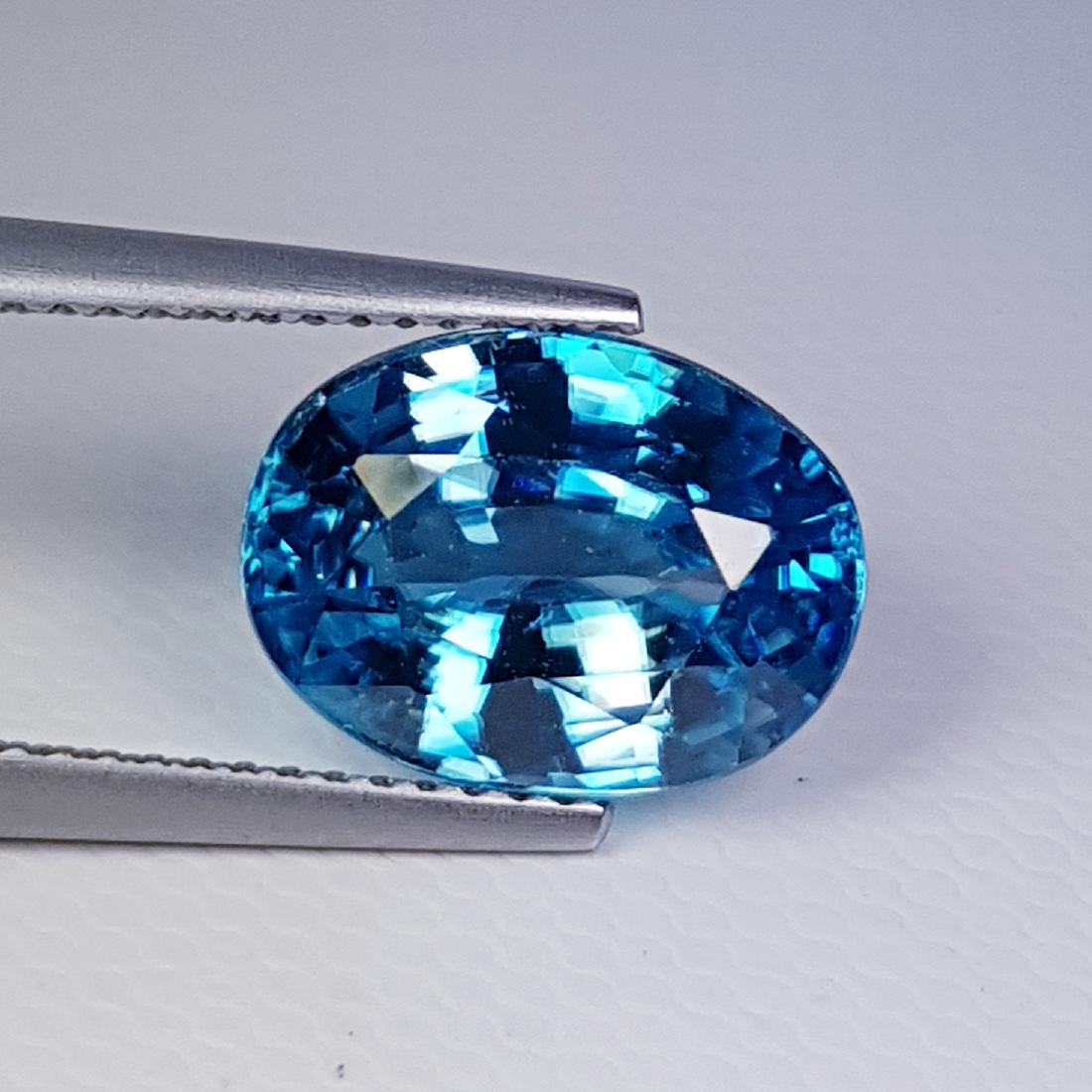 6.45 ct Natural Blue Zircon: Reserve Reduced! Title: 6.45 ct Natural Blue Zircon Brand: Blue Zircon Gemstones: Loosegemstone Color/Clarity: VVS Carat Weights: 6.45 Size/Dimensions: 11.80 x 8.80 x 6.00 Reserve: $190.00 Jasper5