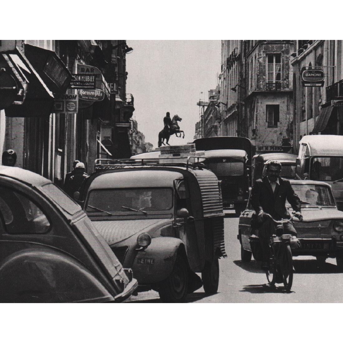 ROBERT DOISNEAU - Traffic Jam in the Rue des: Artist: ROBERT DOISNEAU Print Title: Traffic Jam in the Rue des Petits-Champs, 1969 Medium: Sheet-fed Gravure Printing Date: 1970's Printed in France Image Size: 7 x 5 inches Robert Doisneau (1912-199