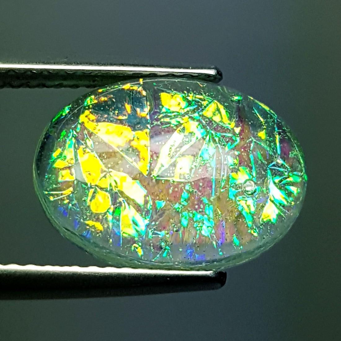 5.95 ct Australian Doublet Opal: No Reserve! Title: 5.95 ct Australian Doublet Opal Color/Clarity: Semi Transparent Gemstones: Gemstones Carat Weights: $6 Size/Dimensions: 13.90 x 10.00 x 5.80 Additional Information: Oval - Australia