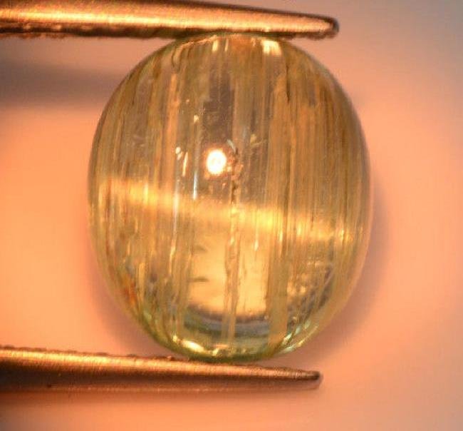 2.42 cts rare certified paraiba tourmaline cat`s eye: Title: 2.42 cts rare certified paraiba tourmaline cat`s eye Color/Clarity: transparent Gemstone Type: natural Carat Weights: 2.42 Additional Information: yes/AIG Reserve: $150.00 Shipping: Dome