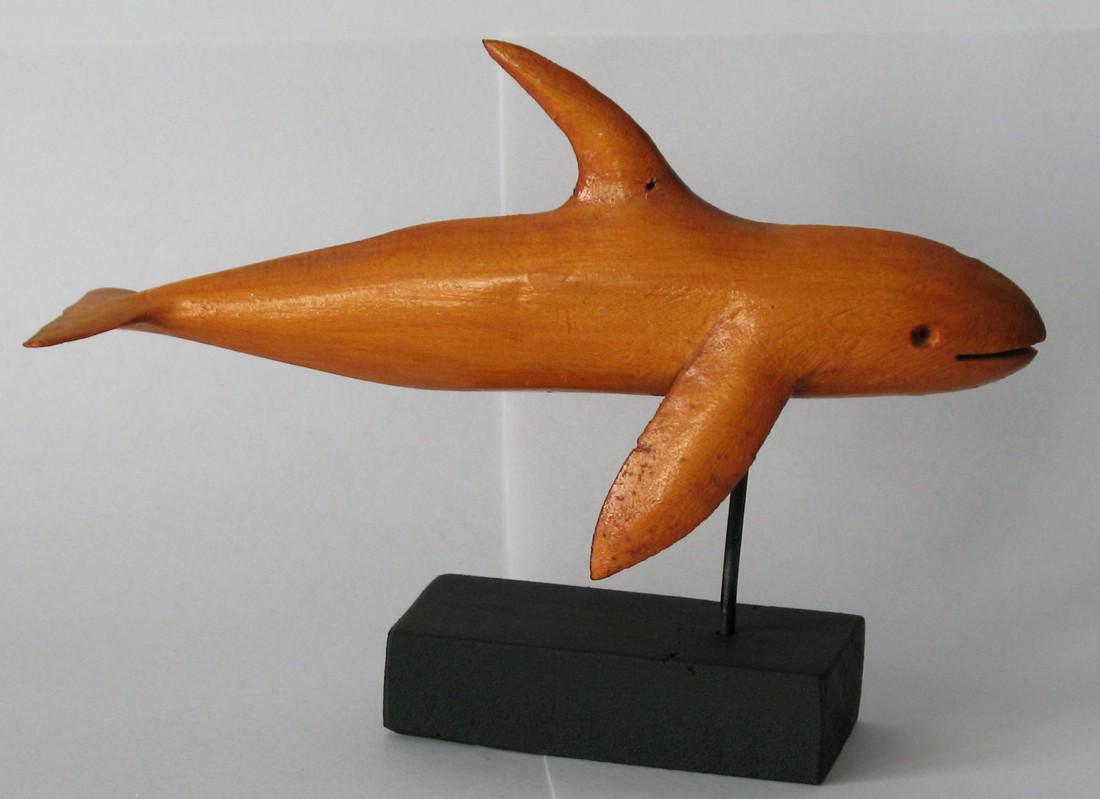 Folk art wood whale carving.: Title: Folk art wood whale carving. Date/Period: 1960's Dimensions: 7” long Provenance: Wood whale carving from Cape Cod. Shipping: Domestic: Flat-rate of $20.00 to anywhere within the contiguous U.