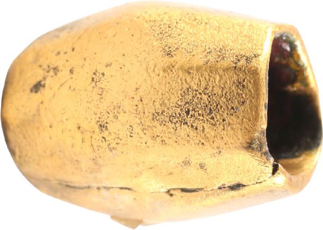 VIKING GILT BRONZE BEAD, 10TH-11TH CENTURY A.D.: Large size as worn by a warrior. Over 1/2:” length of finely faceted barrel form with large stringing hole. Professionally refurbished with the gold overlay restored for modern wear. Beads were valu
