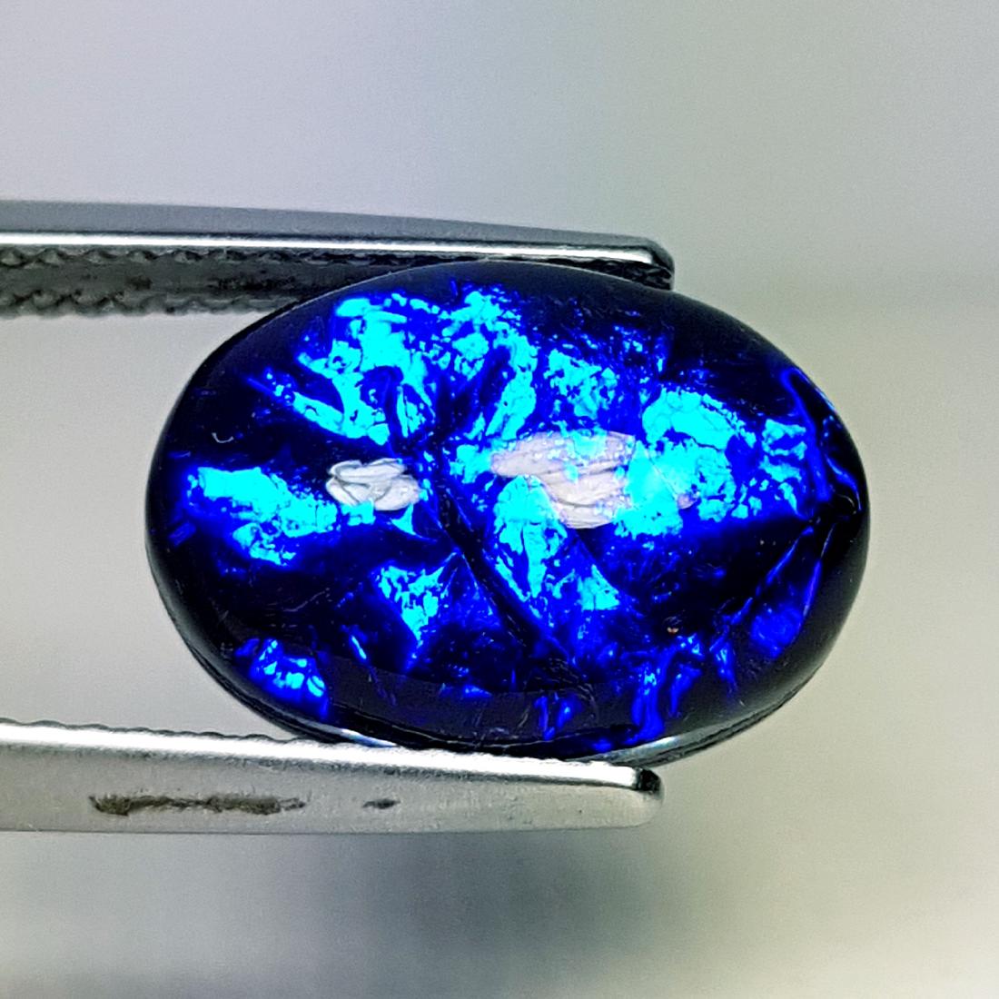 5.95 ct Australian Doublet Opal: No Reserve! Title: 5.95 ct Australian Doublet Opal Color/Clarity: Semi Transparent Gemstones Carat Weights: $6 Size/Dimensions: 14.00 x 10.00 x 5.58 Additional Information: Oval - Australia Shipping:<