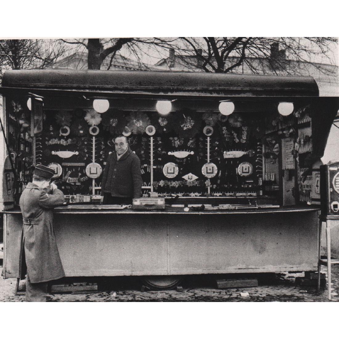 ROBERT DOISNEAU - Shooting Gallery, 1953: Artist: ROBERT DOISNEAU Print Title: Shooting Gallery, 1953 Medium: Sheet-fed Gravure Printing Date: 1970's Printed in France Image Size: 7 x 5.5 inches Robert Doisneau (1912-1994) was a French photog