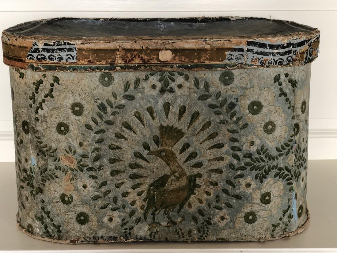 Large Boston wallpaper hatbox: Title: Large Boston wallpaper hatbox Dimensions: 23” wide by 17 1/2” across and 14 1/2” tall. Provenance:Newspaper inside dates to 1830s. Rare peacock wallpaper decorates the outside of this box