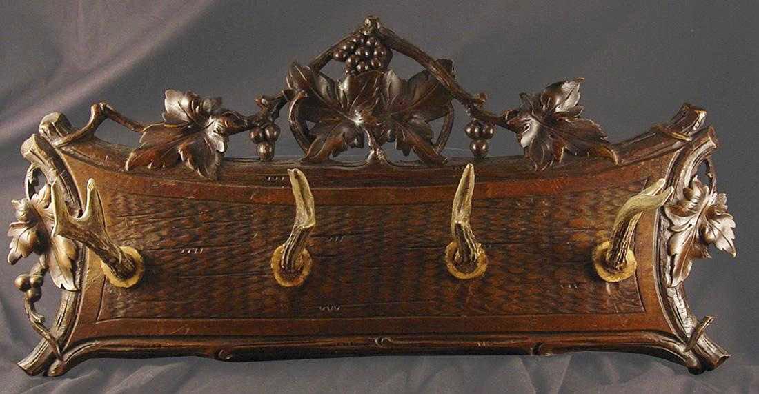 Black Forest "horn & Wood" Coat Rack: Black Forest "Horn & Wood" Coat Rack Late 19th Century. 10" H x 21 1/2" W Coat rack delicately carved with grape vines and real horns as hooks. Swiss; Shipping: Domestic: Flat-rate of $95.00 to anywhe