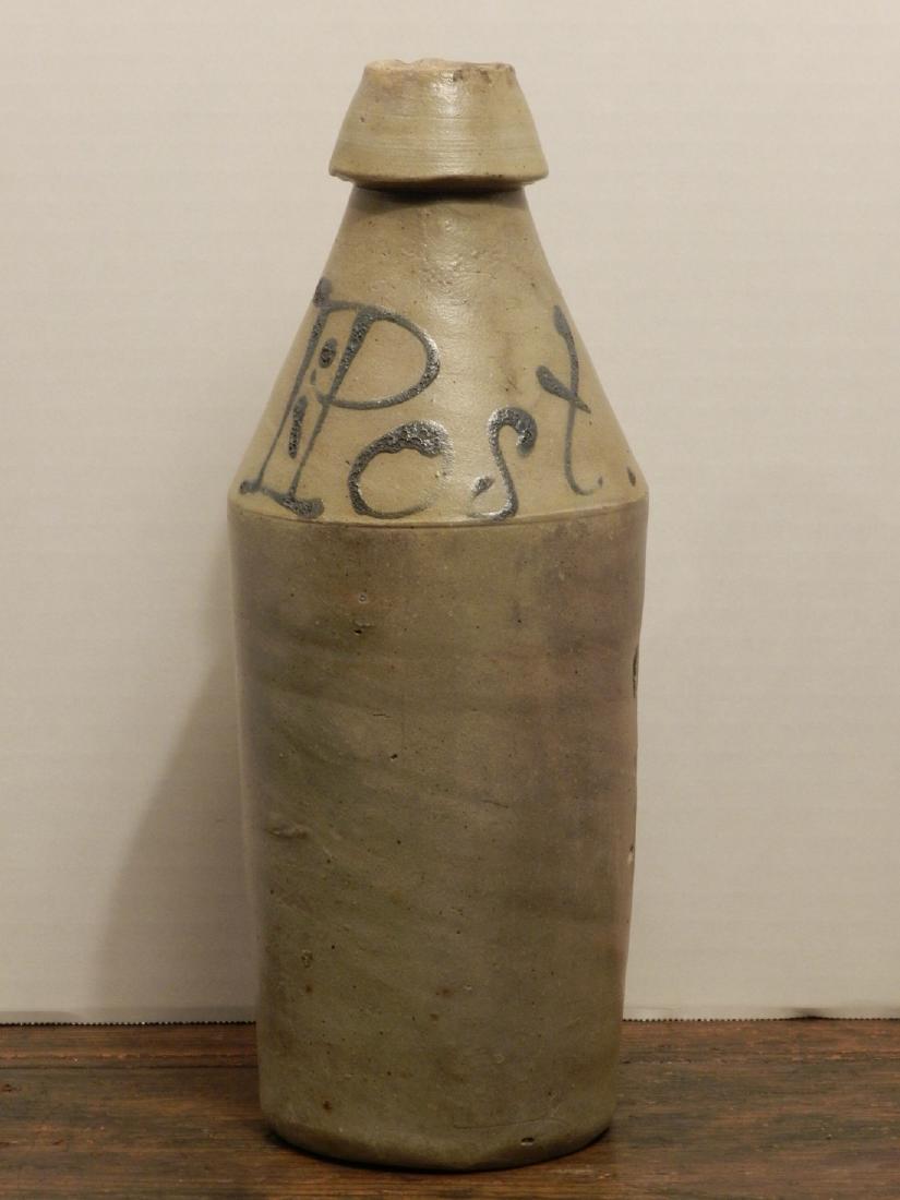 Decorated Stoneware Beer Bottle: Title: Decorated Stoneware Beer Bottle Date/Period: Dimension: 11" Tall X 3-1/2" Dia. Base Provenance/Additional Information:Large Stoneware Beer Bottle Signed "POST". Shipping: Domestic: Flat-rate of