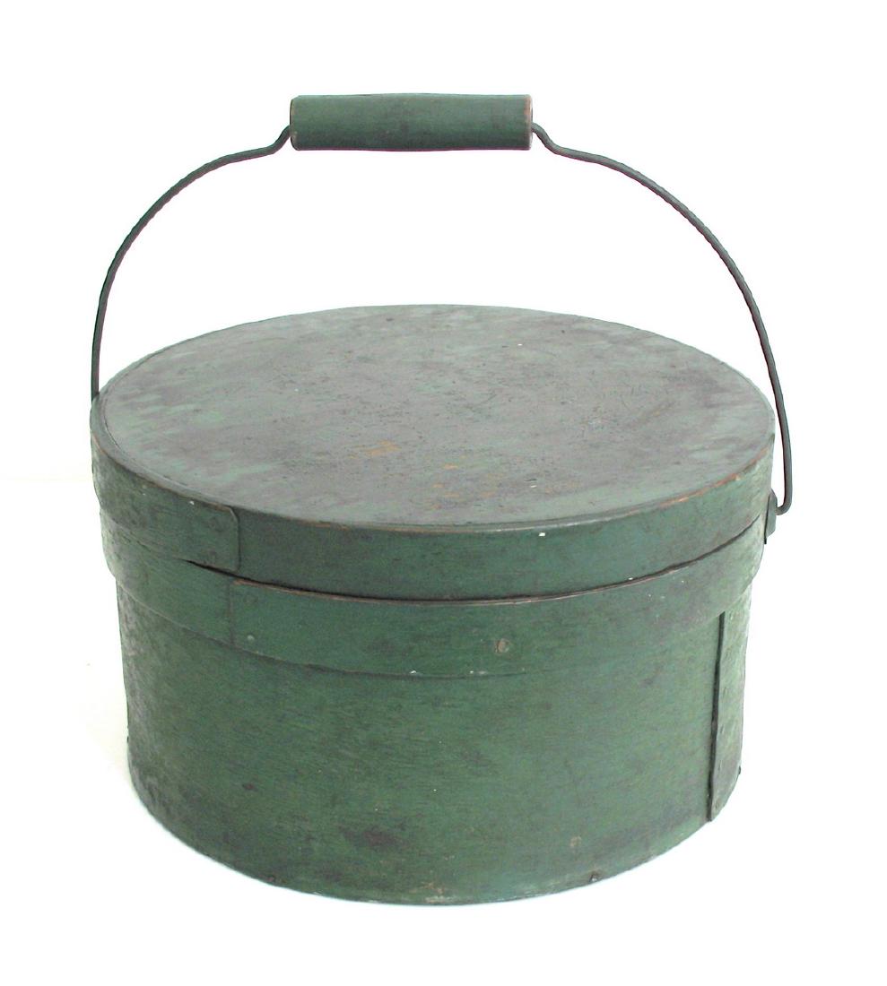 New Englan Bail Handled Pantry Box: Title: New Englan bail handled pantry box. Date: 1860's Dimensions: 11 1/2” diameter x 7” deep Additional Information: Very nice green painted New England bail handled pantry box. Shipping: Domest
