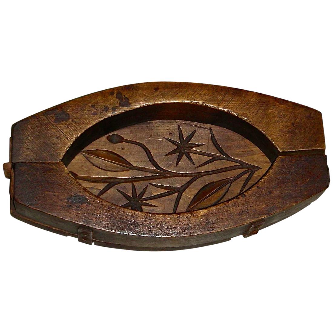 Large, Unusual Hinged Butter Mold w/ Carved Flowers, c.: Title: Large, Unusual Hinged Butter Mold w/ Carved Flowers, c. 1870 Provenance: A large and most unusual hinged butter mold with a flower carved interior. The mold creates an oval or football-shaped l