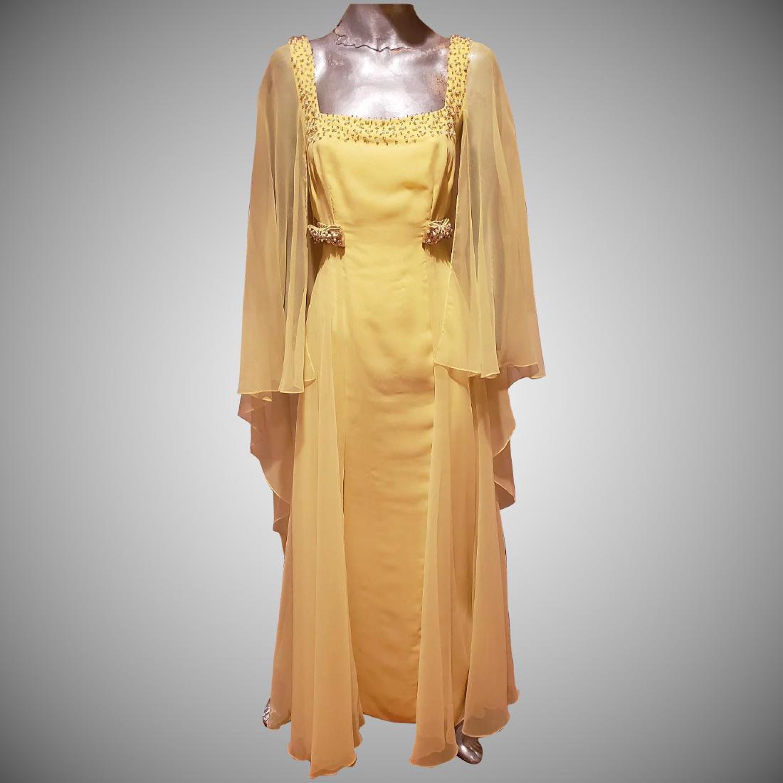 Vtg Jerri Frenell embellished couture dress with cape: Stunning Jerri Frenell custon mad semi couture Empire embellished maxi dress with attached cape in chiffon. Fully lined and a workof Wearable Art Bust-38" Waist-36" Hip-Free Please note that the Start