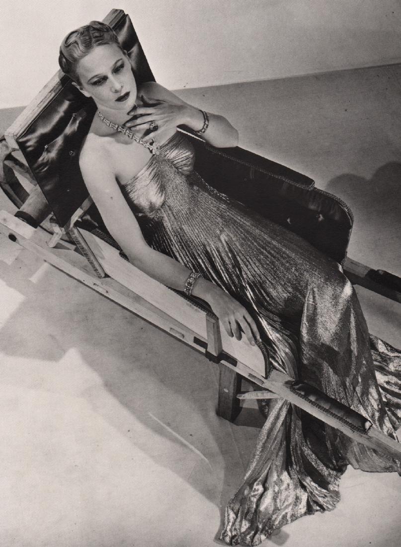 MAN RAY - Lucien Lelong's model sitting in Dominguez's: Artist: MAN RAY Print Title: Lucien Lelong's model sitting in Dominguez's wheelbarrow Medium: PhotoLitho Printed Printed 1981 in Japan Image size (inches) approx. 9 x 7” Man Ray was an American visu