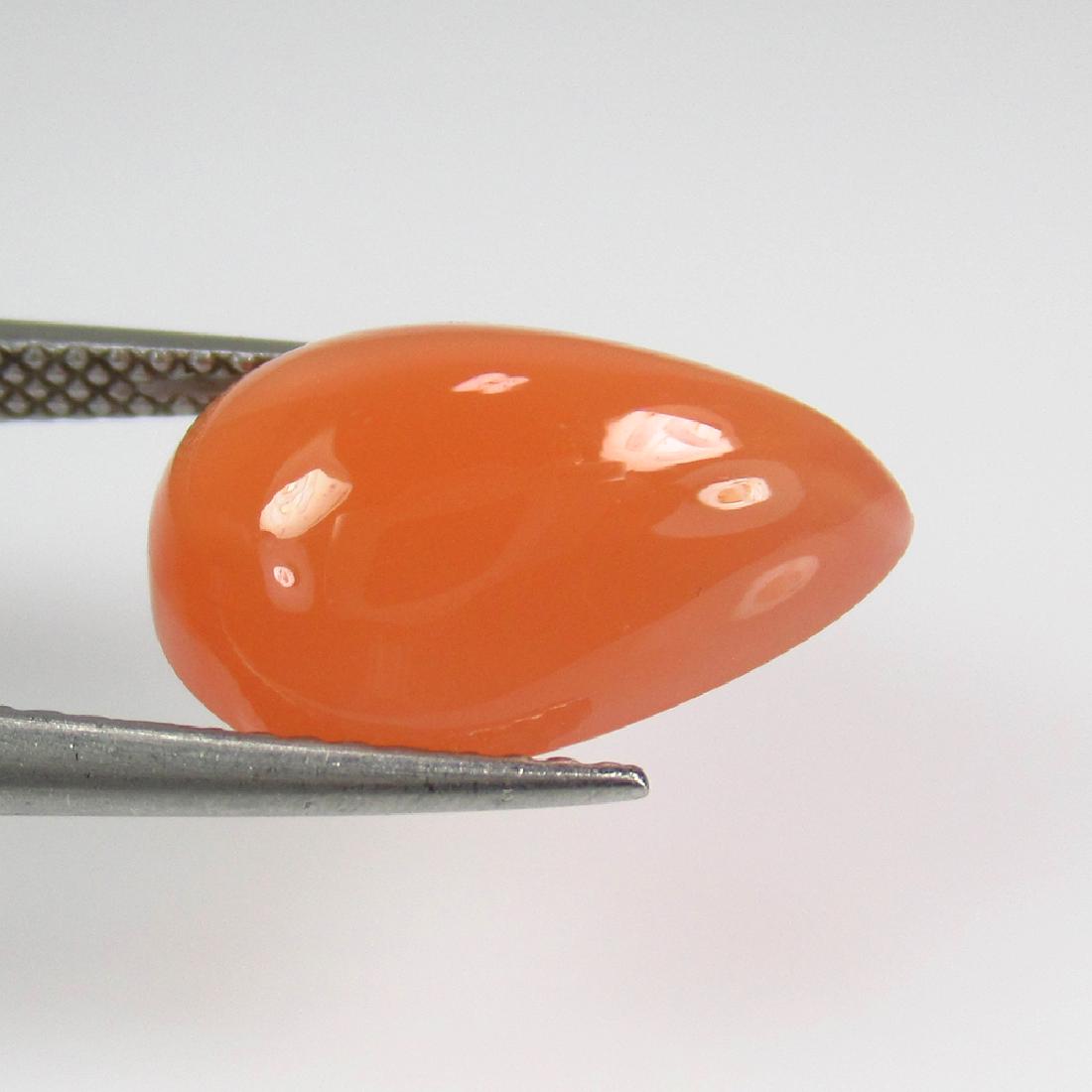 5.58 Ctw Natural Orange Moonstone 15X10 mm Pear Cab: No Reserve! Title: 5.58 Ctw Natural Orange Moonstone 15X10 mm Pear Cab Stone Clarity: Opaque Gemstones: Moonstone Carat Weights: 5.58 Size/Dimensions: 15.10 x 9.90 x 6.20 mm Additional Information: Or
