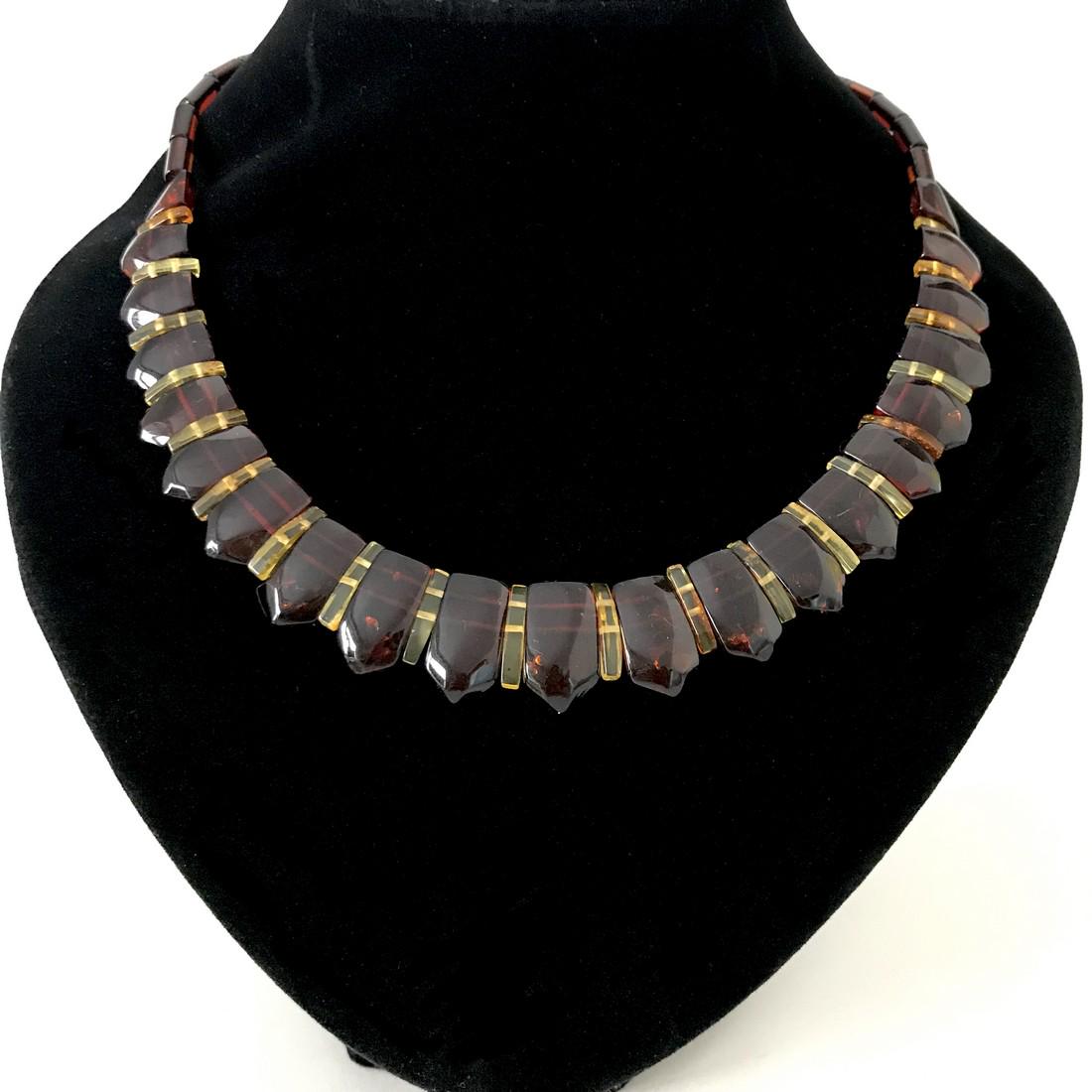 Wide collar necklace cut Baltic amber cognac&lemon: Title: Wide collar necklace cut Baltic amber cognac&lemon Gemstone: Amber Weight: 16.8 gr Size: length 48cm, width 20 mm Additional Information: hand carved cabochon in colour: cognac + honey Reserve: