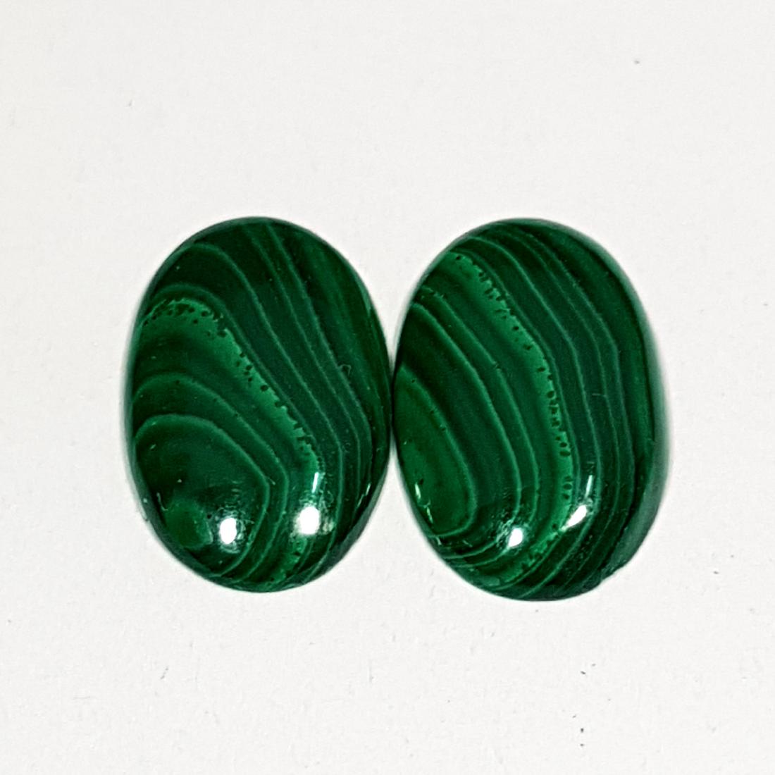 2 Pcs of Natural Malachite Oval Cut - 7.05 ct: No Reserve! Title: 2 Pcs of Natural Malachite Oval Cut - 7.05 ct Color/Clarity: Opaque Gemstones: Gemstones Carat Weights: 7.05 Size/Dimensions: 15.10 x 8.90 x 2.30/15.30 x 9.10 x 2.60 Additional Info