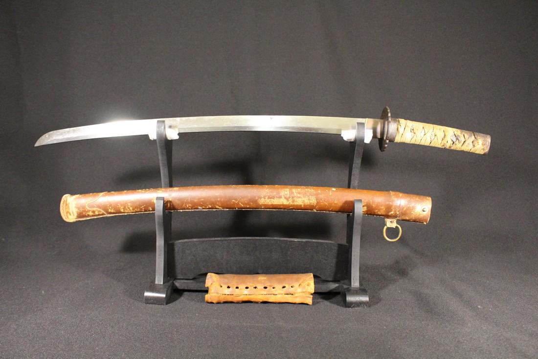 Antique Japanese Sword - A Sukesude WW2 Combat: Title: Antique Japanese Sword - A Sukesude WW2 Combat Wakizashi Origin: Japan Date/Period: 1660's Dimensions: 21 1/2 Nagasa A World War 2 bring back Sukesada wakizashi. This is an excellent example of