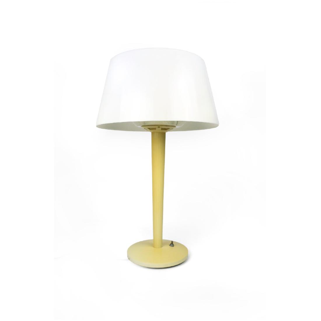 Vintage Gerald Thurston for Lightolier Table Lamp: A lovely vintage table lamp by Gerald Thurston for Lightolier. Plastic base with plastic shade that glows beautifully when turned on. On/off switch is on the base.; 14” x 14” x 23” Reserve: $175