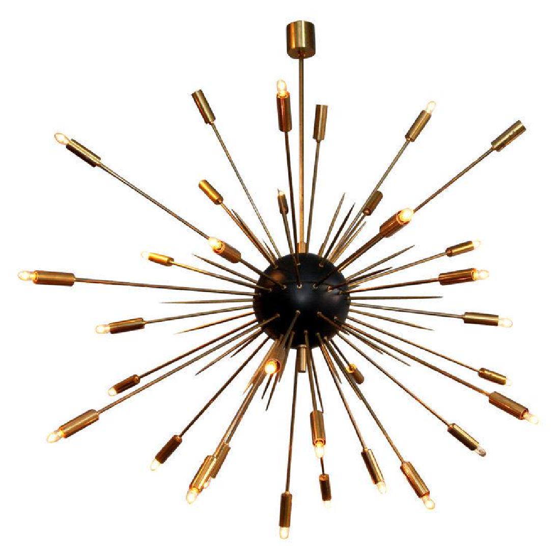 Large Sputnik Chandelier: Condition; Current Wiring - US; Dimensions; Height: 57" / 144.78cm Diameter: 60" / 152.4cm; No. of Items; 1; Description; Large scale light fixture reminiscent of an exploding star. Brass rods--both l